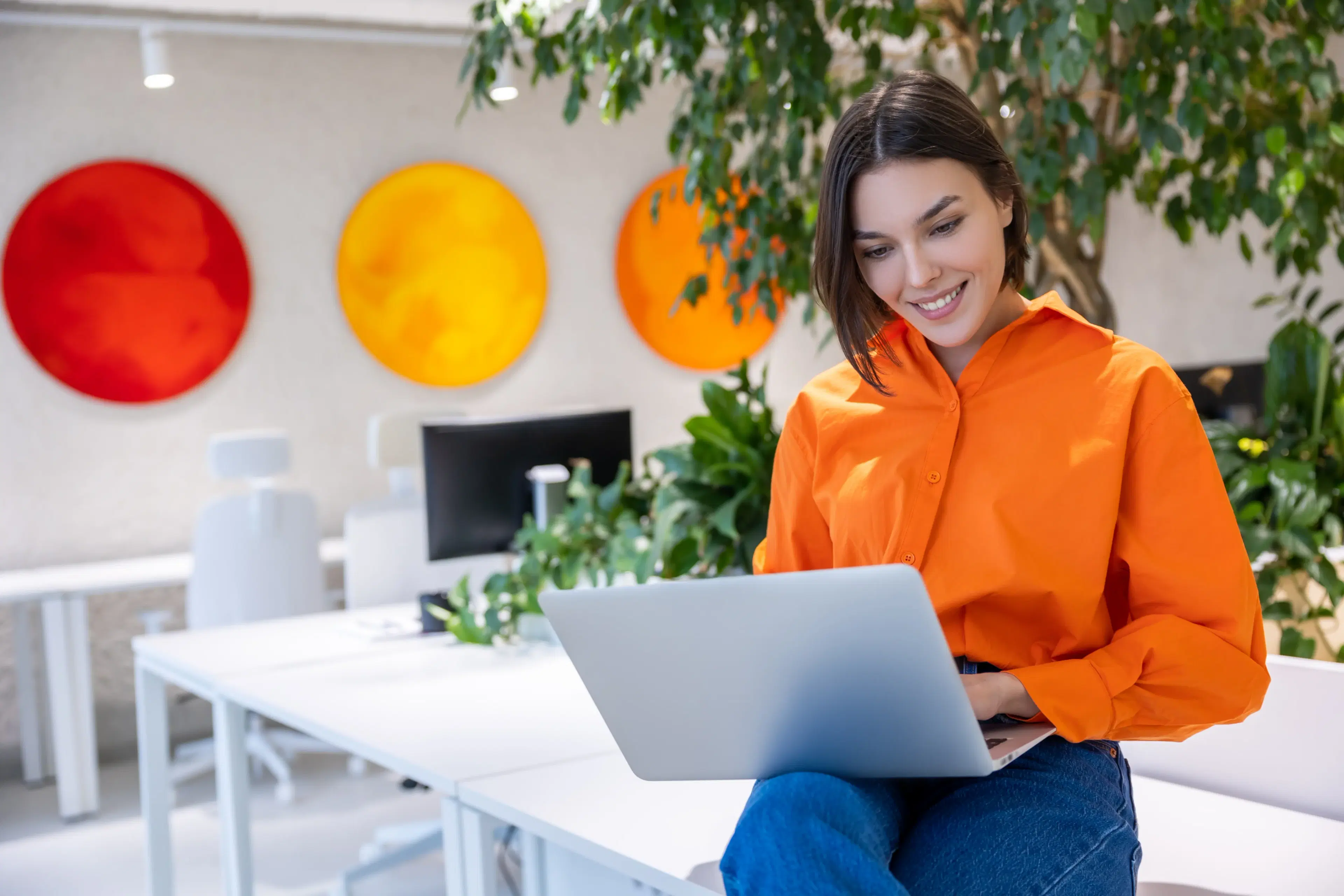 Woman working on laptop in modern office
